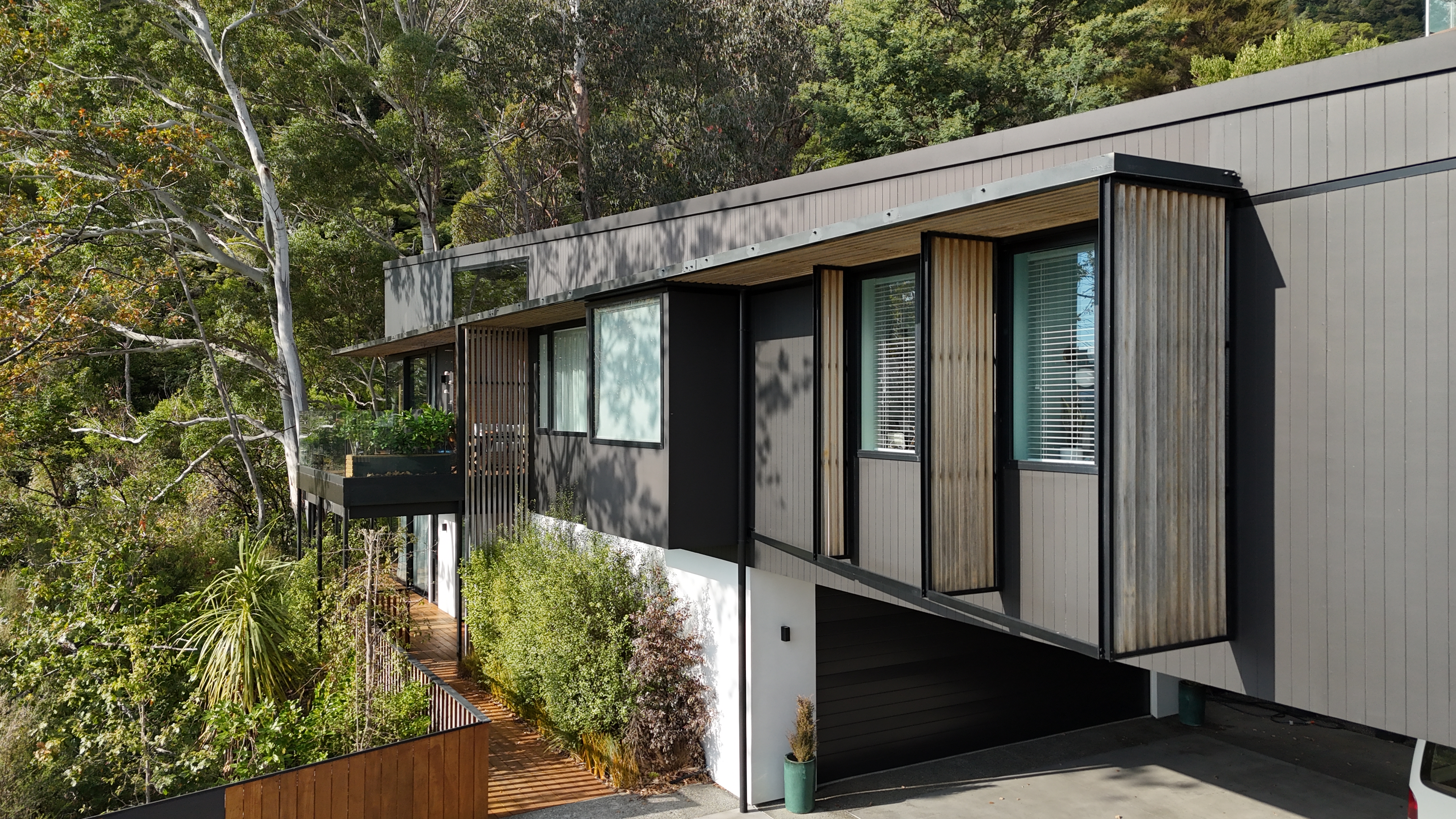 Modern New Zealand architectural home in a Marlborough vineyard at golden hour